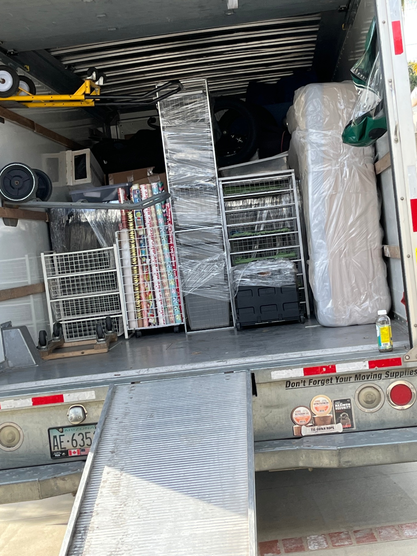Inside a fully loaded Green Echo moving truck — furniture wrapped and stacked tightly with no shifting